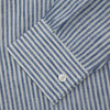 View 4 of product The Turnbull & Asser Sky Blue Linen Stripe Weekend Fit Shirt features blue and white vertical stripes, a Derby collar, and buttoned cuffs—ideal for pairing with classic cotton suits or other Weekend Fit shirts.