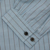 View 3 of product Turnbull & Asser's Pale Blue Stripe Cotton Holiday Fit Shirt features a revere collar, thin black pinstripes, single button cuff, chest pocket, and black buttons—crafted from Italian cotton and laid flat on a white background.