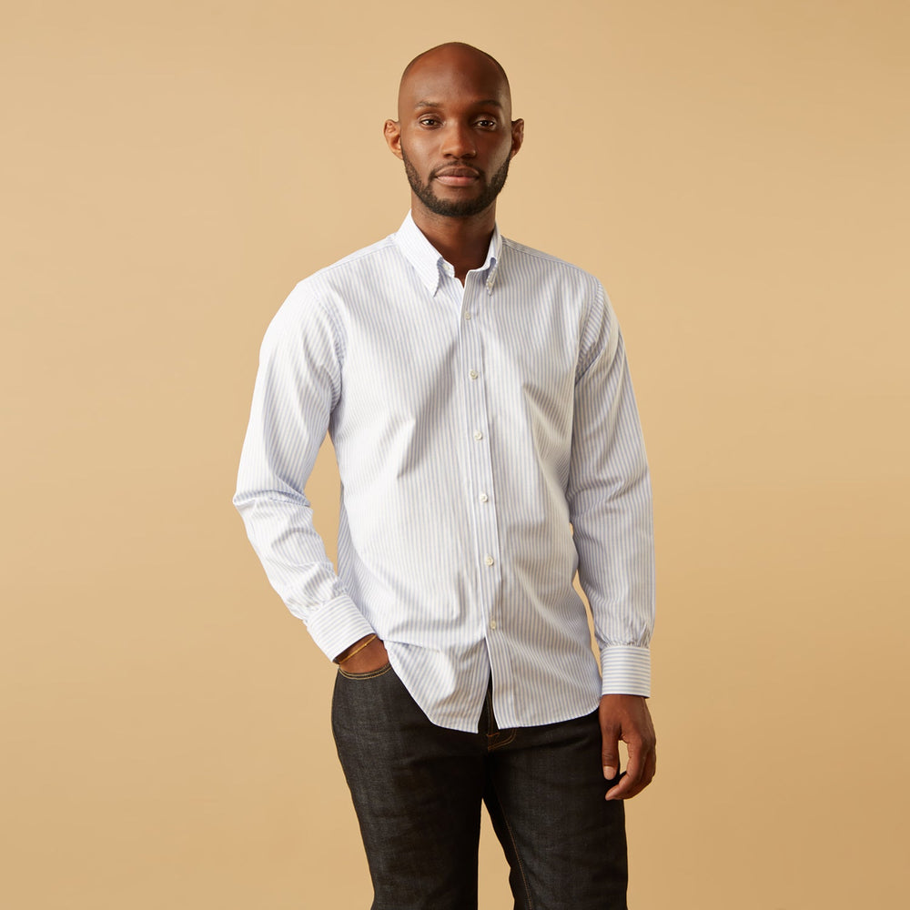 The Turnbull & Asser Pale Blue Stripe Weekend Fit Hayne Shirt features a Dorset collar, 1-button cuffs, and is displayed flat on a white background—ideal for those seeking our relaxed Weekend Fit style.