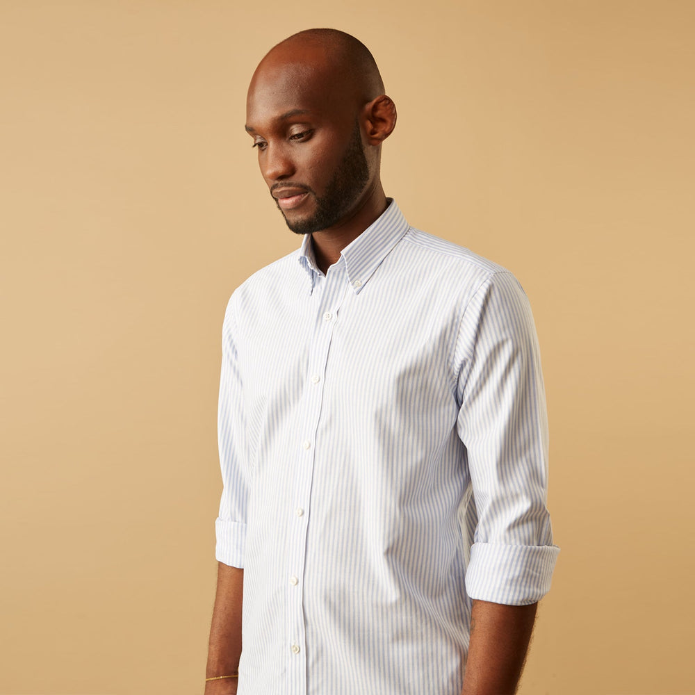 The Turnbull & Asser Pale Blue Stripe Weekend Fit Hayne Shirt features a Dorset collar, 1-button cuffs, and is displayed flat on a white background—ideal for those seeking our relaxed Weekend Fit style.