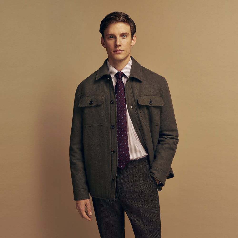The Green Quilted Cashmere Amhurst Overshirt by Turnbull & Asser features a collar, long sleeves, button-flap chest pockets, and thermo-regulating graphene wadding. Displayed on a plain white background.