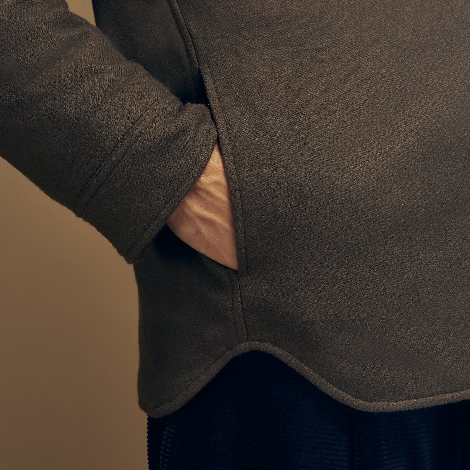 View 6 of product The Green Quilted Cashmere Amhurst Overshirt by Turnbull & Asser features a collar, long sleeves, button-flap chest pockets, and thermo-regulating graphene wadding. Displayed on a plain white background.