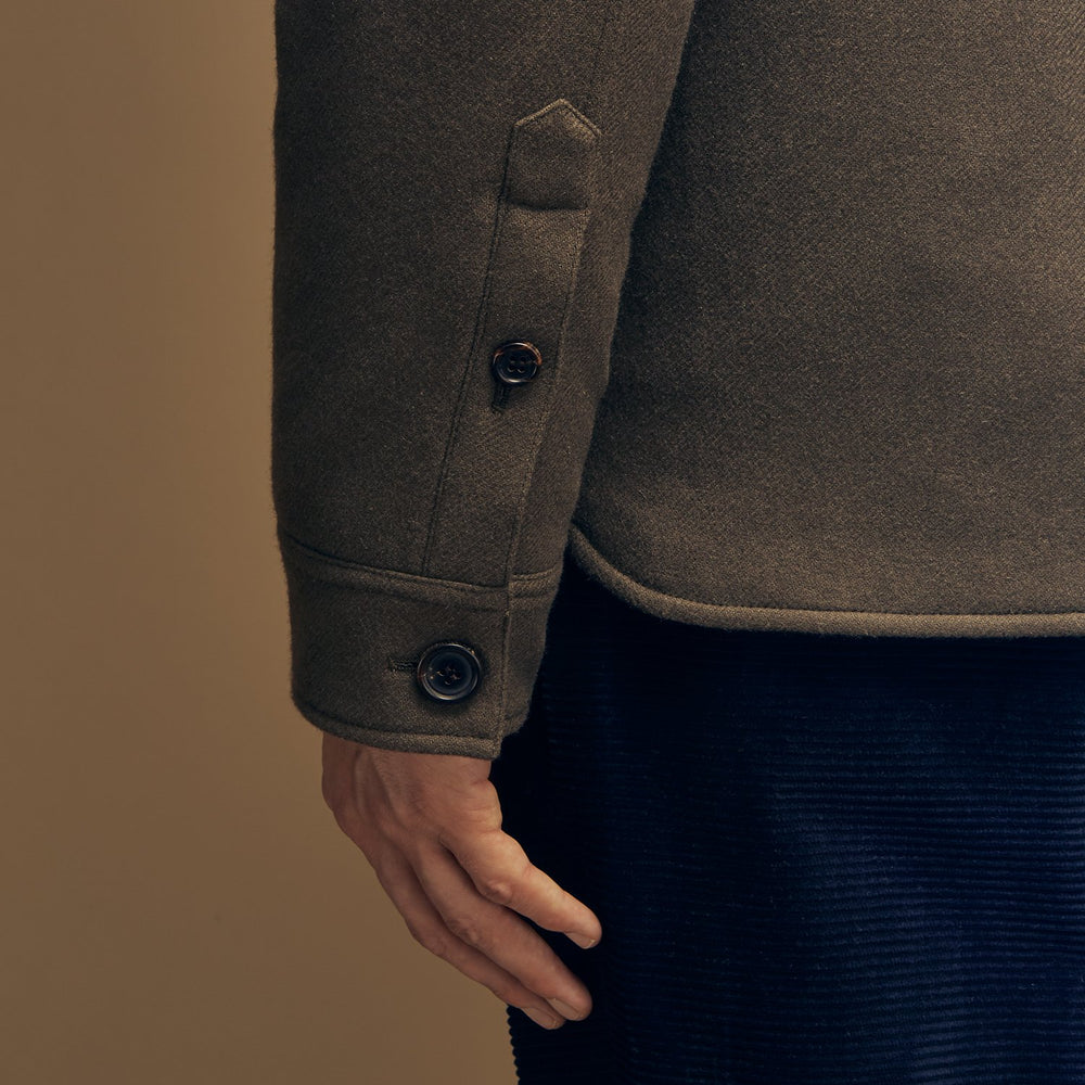 The Green Quilted Cashmere Amhurst Overshirt by Turnbull & Asser features a collar, long sleeves, button-flap chest pockets, and thermo-regulating graphene wadding. Displayed on a plain white background.