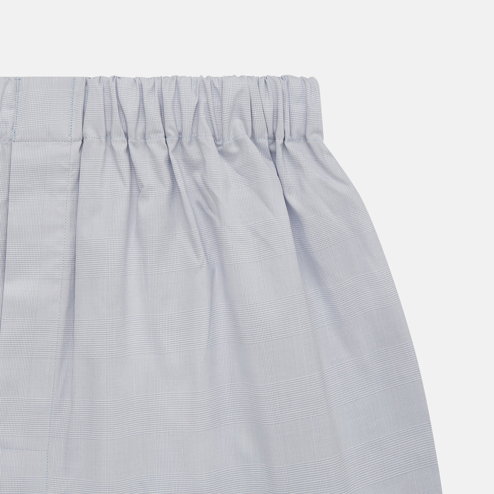 Faded Blue Block Check Cotton Godfrey Boxer Shorts by Turnbull & Asser, shown flat on a white background. These luxury boxers offer a relaxed fit and smooth, simple design with an elastic waistband and no visible buttons or patterns.