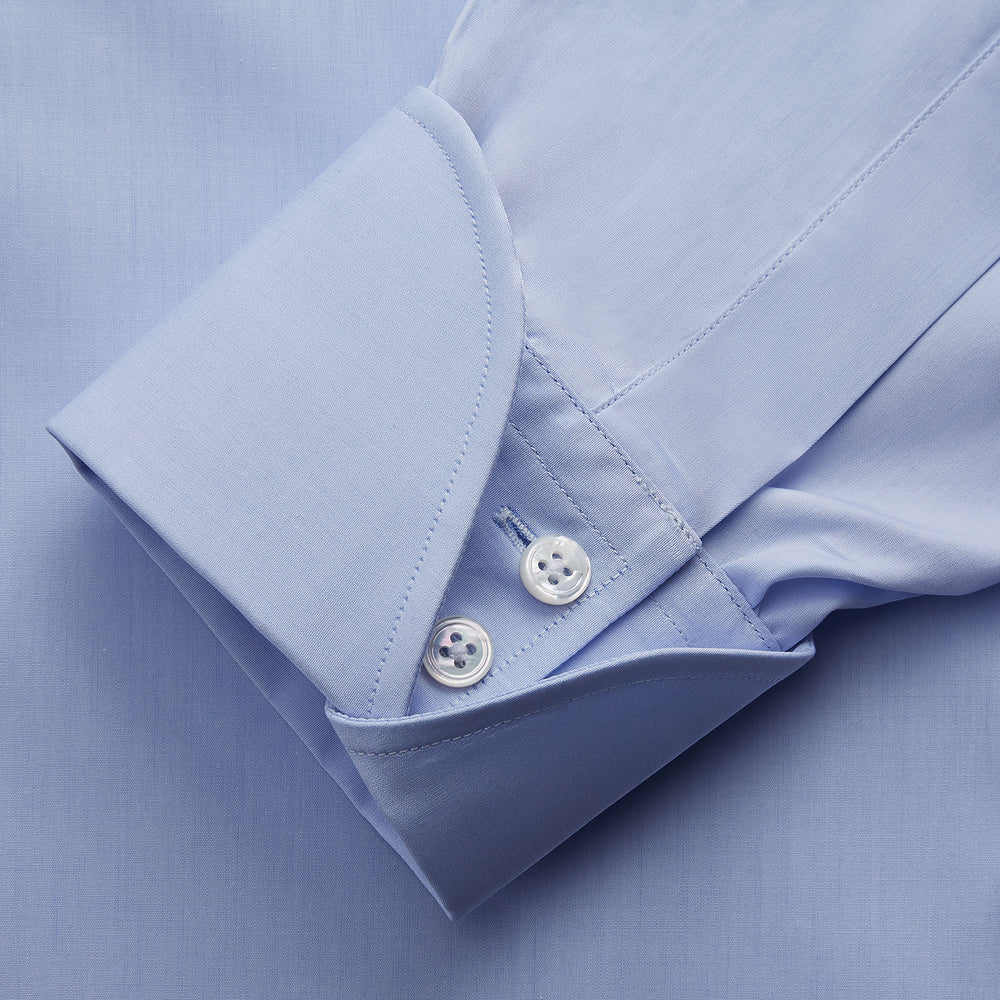 The Turnbull & Asser DR. NO Pale Blue West Indian Sea Island Cotton Shirt features a signature DR. NO collar and cuff, as seen on James Bond, and is displayed on a white background.