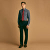 View 8 of product A man in a tie wears the Turnbull & Asser Navy Check Regular Fit Flannel Shirt with T&A collar and 3 button cuffs.