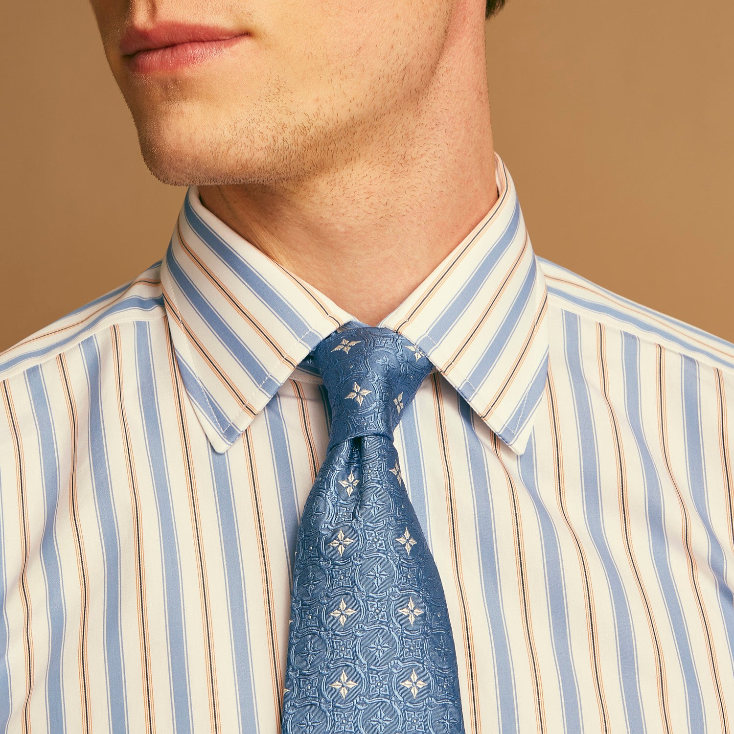 View 3 of product The Turnbull & Asser Blue Multi Stripe Regular Fit Shirt features a classic T&A collar, 3 button cuffs, and vertical blue, white, and yellow stripes for a timeless look.
