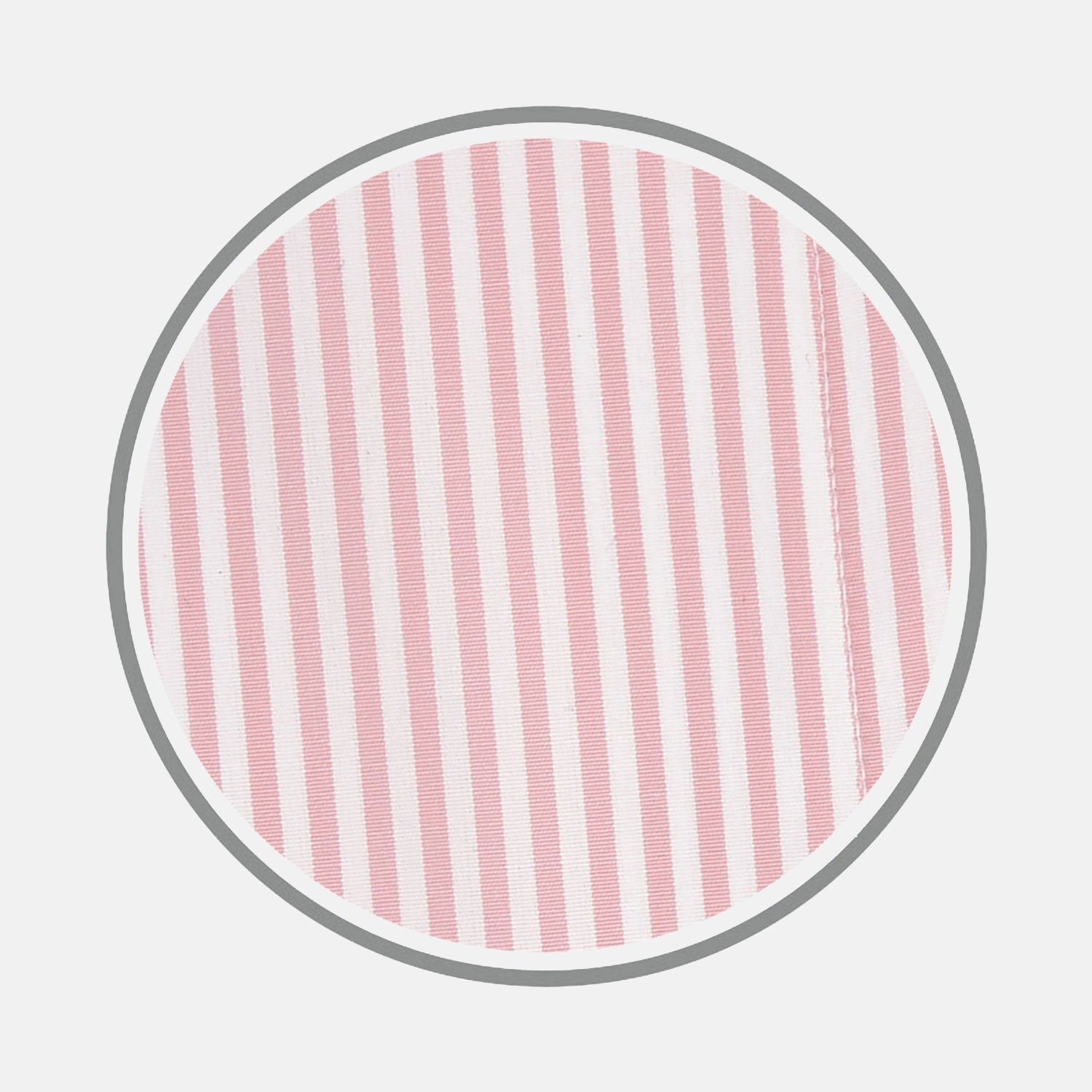 View 1 of product Close-up of Turnbull & Asser's Pink Bengal Stripe Cotton Fabric, featuring pink and white vertical stripes within a circular frame on a white background. A seam appears near the right edge of the fabric.