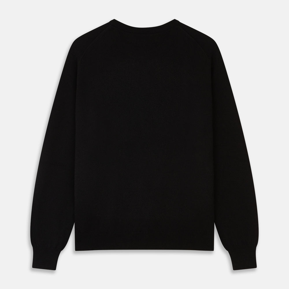 The Turnbull & Asser Black Crew Neck Cashmere Jumper is shown laid flat on a white background, featuring ribbed cuffs and hem with a small white label inside the collar.