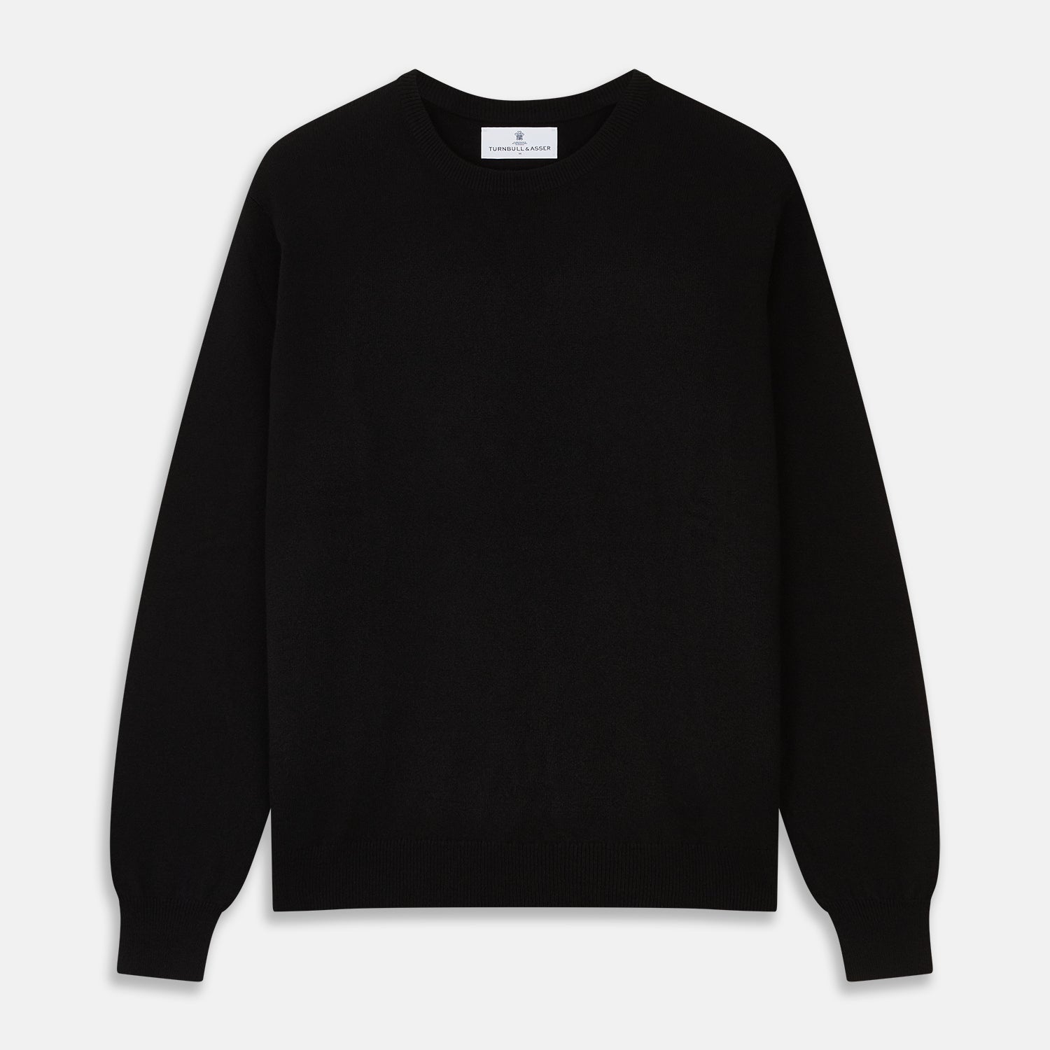 View 1 of product The Turnbull & Asser Black Crew Neck Cashmere Jumper is shown laid flat on a white background, featuring ribbed cuffs and hem with a small white label inside the collar.