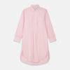 View 1 of product The Turnbull & Asser Pink Piped End-On-End Cotton Nightshirt features long sleeves, a pointed collar, button-down front, chest pocket, and a curved high-low hem for timeless, relaxed style.
