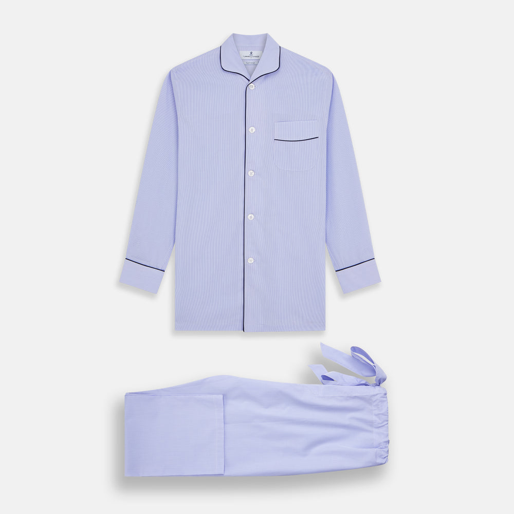 Turnbull & Asser's Blue Fine Check Piped Sea Island Quality Cotton Pyjama Set features white buttons, black piping on the collar, cuffs, and pocket, with matching drawstring pants—displayed flat on a white background.