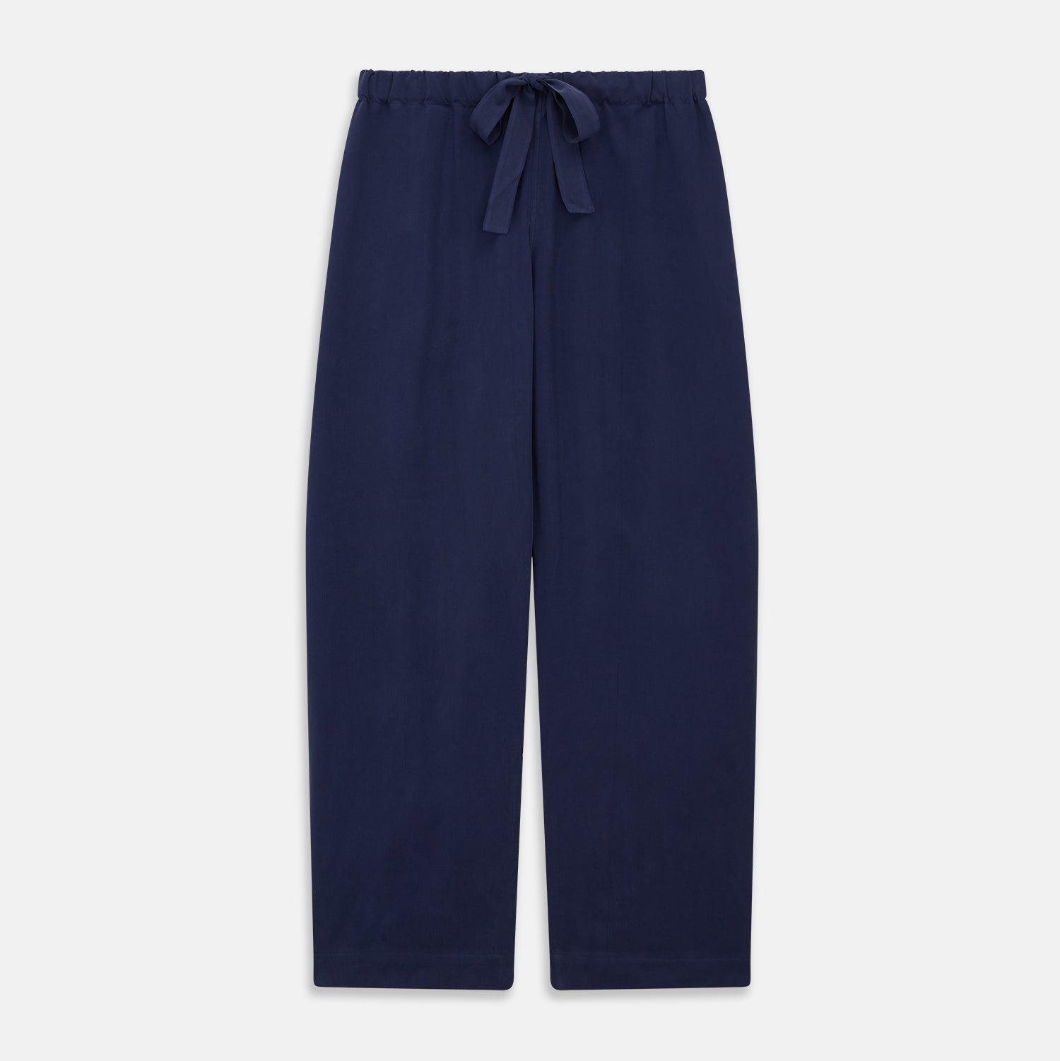 View 6 of product The Women's Harriet Navy Silk Pyjama Set by Turnbull & Asser features a long-sleeve, button-up top with white piping and chest pocket, plus matching drawstring pants—luxurious sleepwear displayed on a white background.