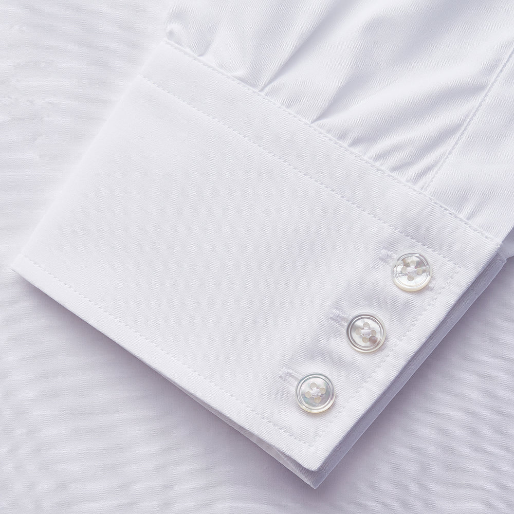 The Turnbull & Asser White Organic Cotton Regular Fit Mayfair Shirt features long sleeves, a classic collar, and button-down front, shown laid flat against a white background.