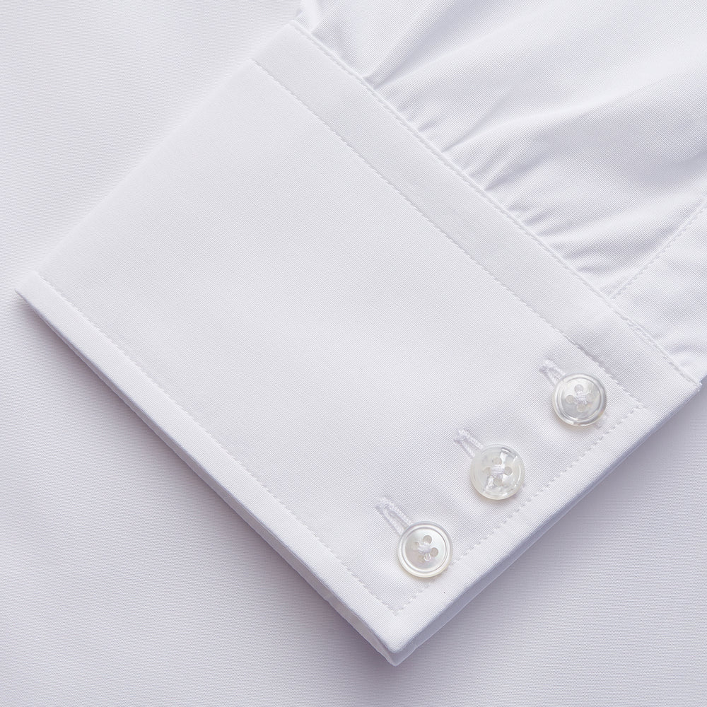 The Turnbull & Asser White Organic Cotton Tailored Fit Hove Shirt is a classic long-sleeve dress shirt with a button-down front and collar, crafted from soft organic cotton and shown on a white background.