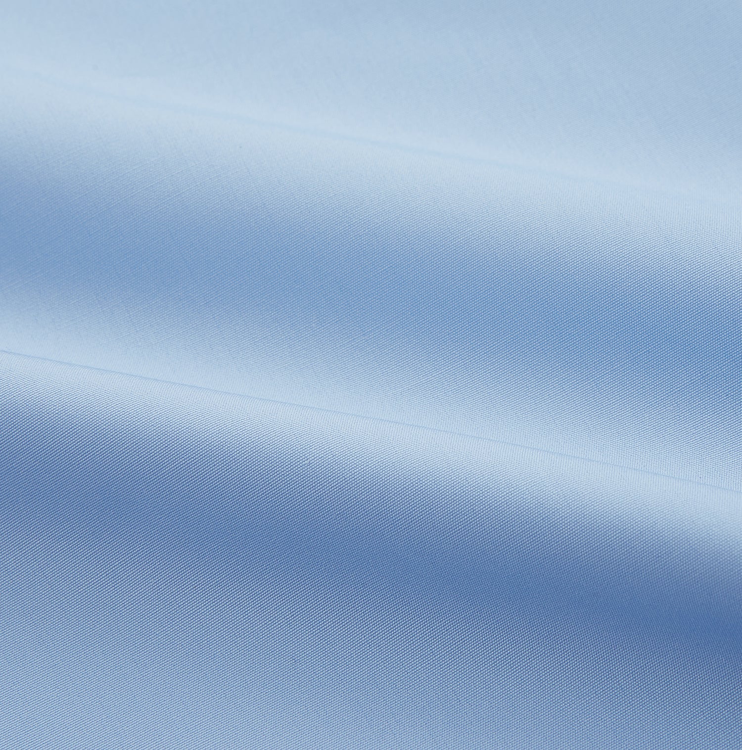 View 4 of product The Turnbull & Asser Pale Blue Organic Cotton Tailored Fit Hove Shirt is a formal long-sleeve button-up with a classic collar and white buttons, crafted from premium organic cotton and shown on a plain white background.