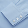 View 3 of product The Turnbull & Asser Pale Blue Organic Cotton Tailored Fit Hove Shirt is a formal long-sleeve button-up with a classic collar and white buttons, crafted from premium organic cotton and shown on a plain white background.