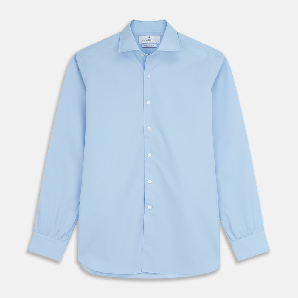 The Turnbull & Asser Pale Blue Organic Cotton Tailored Fit Hove Shirt is a formal long-sleeve button-up with a classic collar and white buttons, crafted from premium organic cotton and shown on a plain white background.