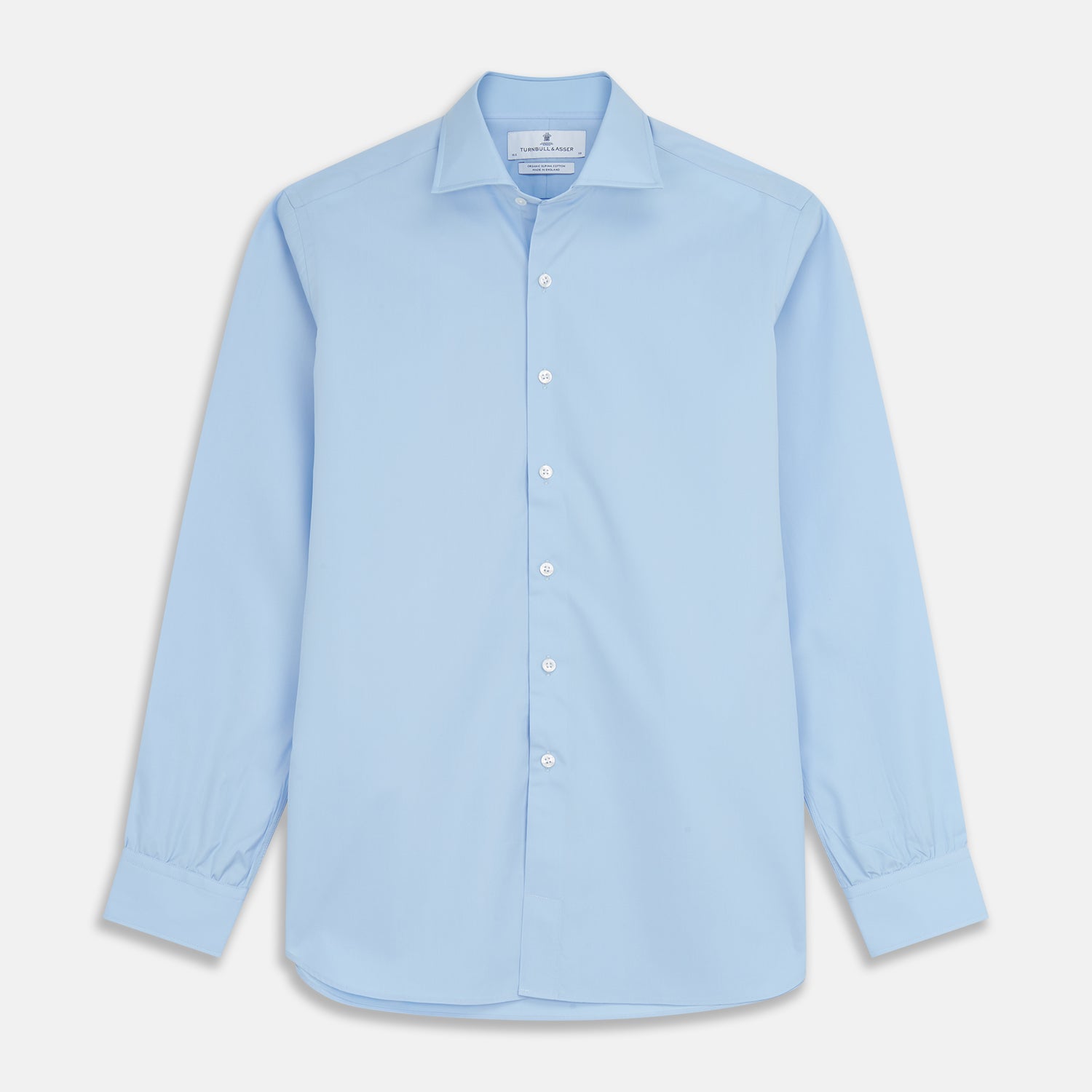 View 1 of product The Turnbull & Asser Pale Blue Organic Cotton Tailored Fit Hove Shirt is a formal long-sleeve button-up with a classic collar and white buttons, crafted from premium organic cotton and shown on a plain white background.
