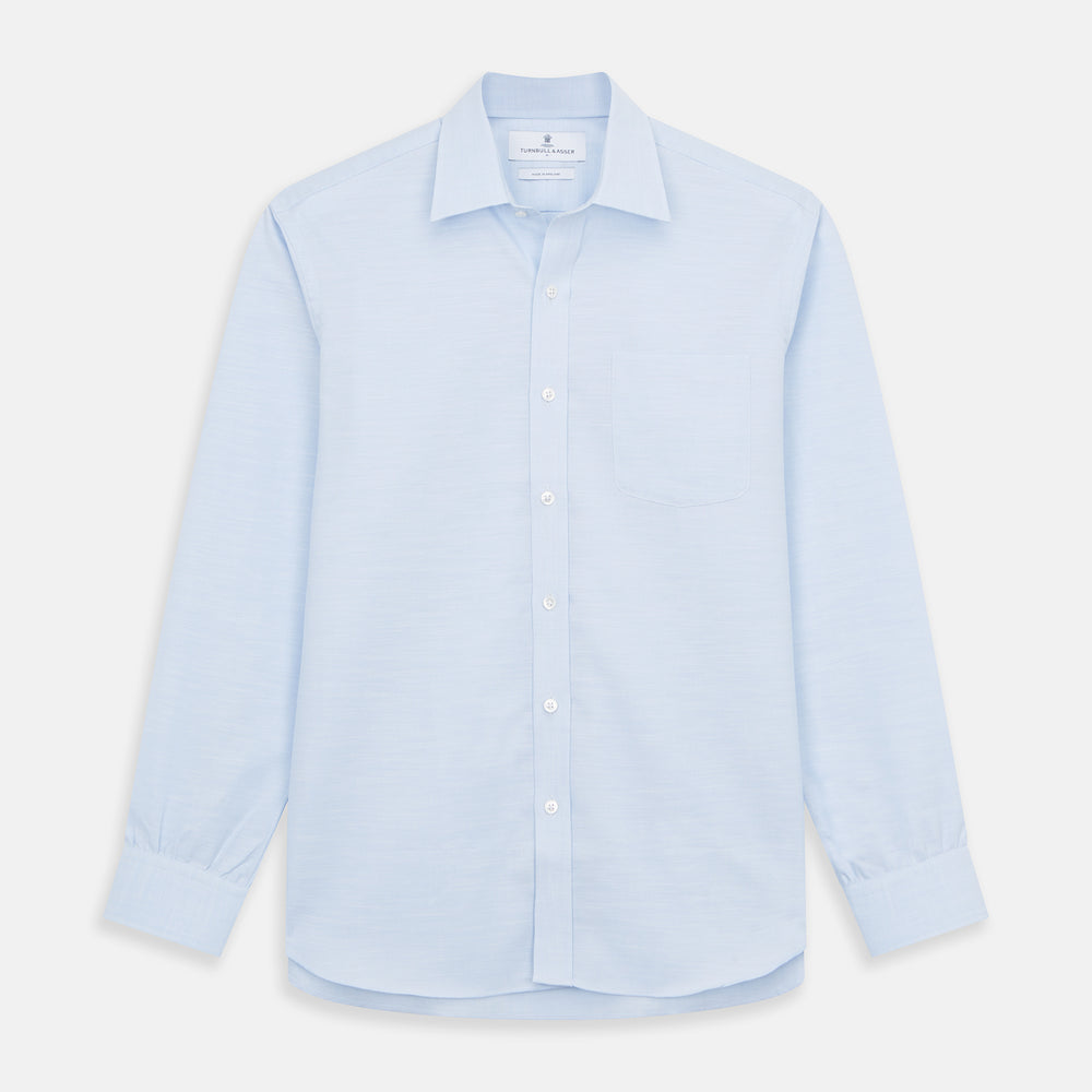 The Turnbull & Asser Plain Blue Weekend Fit Chambray Finch Shirt features a Derby collar, long sleeves, and a front chest pocket—shown laid flat on white—ideal for casual weekend wear.