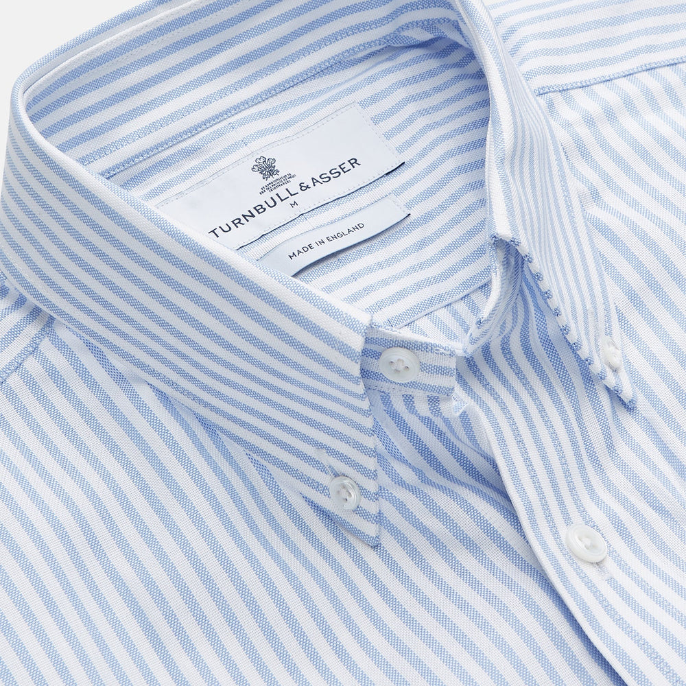 The Turnbull & Asser Pale Blue Stripe Weekend Fit Hayne Shirt features a Dorset collar, 1-button cuffs, and is displayed flat on a white background—ideal for those seeking our relaxed Weekend Fit style.