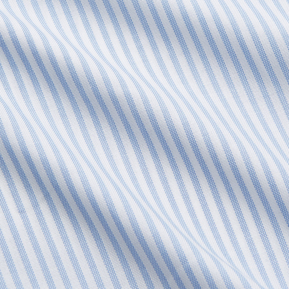 The Turnbull & Asser Pale Blue Stripe Weekend Fit Hayne Shirt features a Dorset collar, 1-button cuffs, and is displayed flat on a white background—ideal for those seeking our relaxed Weekend Fit style.
