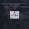 View 2 of product The Turnbull & Asser Navy Lightweight Wool Hopsack Traveller Jacket features a notched lapel, three front buttons, and four flap pockets—two on the chest and two at the waist—all displayed on a plain white background.