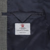 View 2 of product The Turnbull & Asser Grey Prince of Wales Check Wool Hopsack Jacket features a notched lapel, two-button closure, two front flap pockets, and a chest pocket, shown on a plain white background.