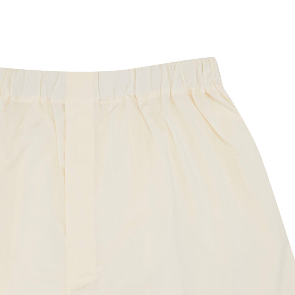 The Plain Cream Cotton Boxer Shorts by Turnbull & Asser feature an elasticated waistband and are shown flat on a white background.