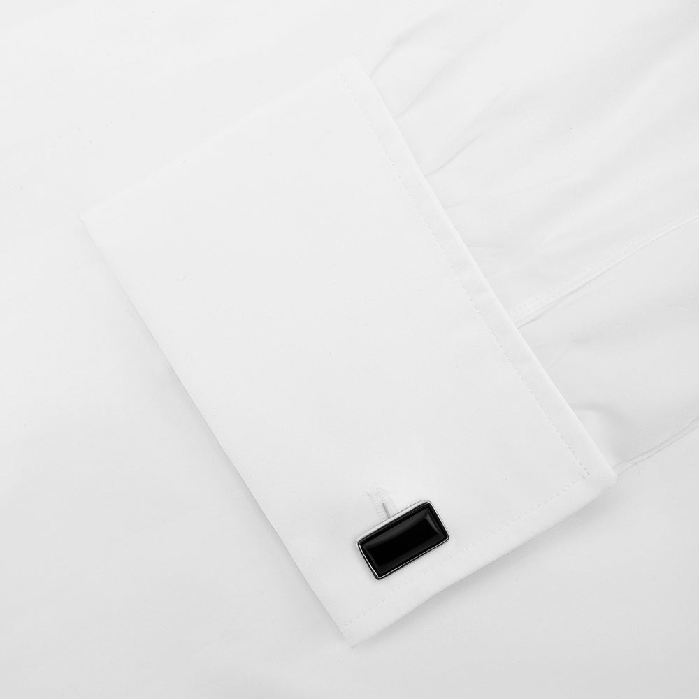Turnbull & Asser's Reversible Monochrome Sterling Silver Rectangular Cufflinks feature black onyx on one side and white mother-of-pearl on the other, shown against a plain light gray background.