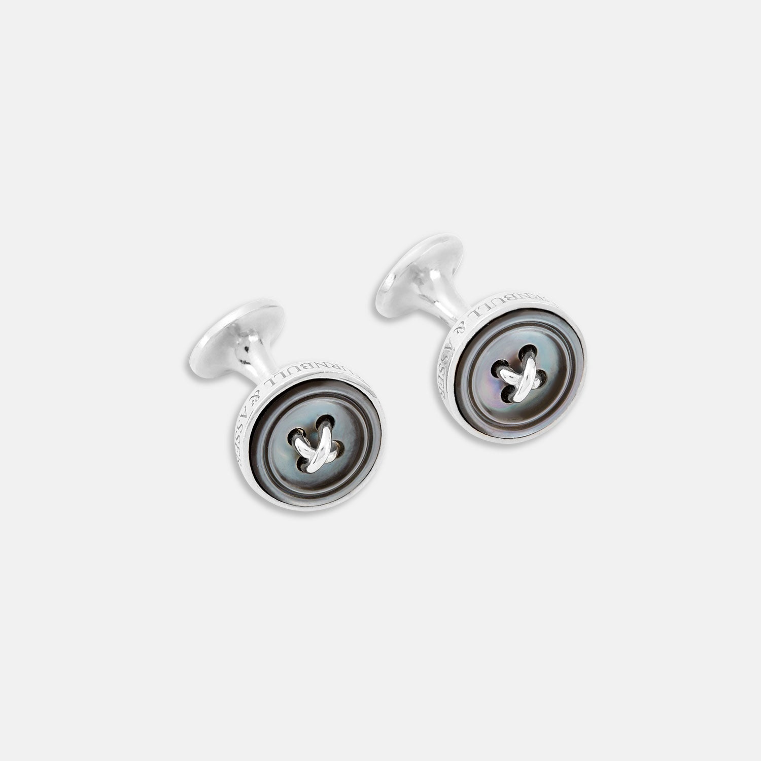 View 1 of product Turnbull & Asser's Smoke Sterling Silver Mother-of-Pearl Button Cufflinks feature a round, button-inspired design with a dark iridescent center and four holes, showcasing British style against a plain white background.