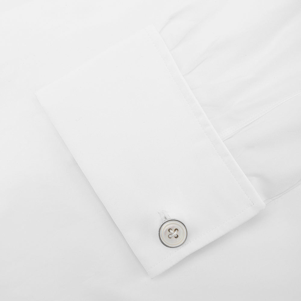 Turnbull & Asser's White Sterling Silver Mother-of-Pearl Button Cufflinks, designed with a four-hole button motif and mother-of-pearl center, are displayed on a light gray background.