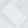 View 2 of product The Weekend Fit Cream Linen Shirt by Turnbull & Asser features a stand collar, button front, and 1-button cuff. Displayed neatly folded, the cream linen shirt highlights its refined craftsmanship against a light grey background.