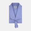 View 1 of product The Turnbull & Asser Mid Blue Gingham Check Piped Cotton Gown, featuring a shawl collar and tied belt, is elegantly displayed against a white background.