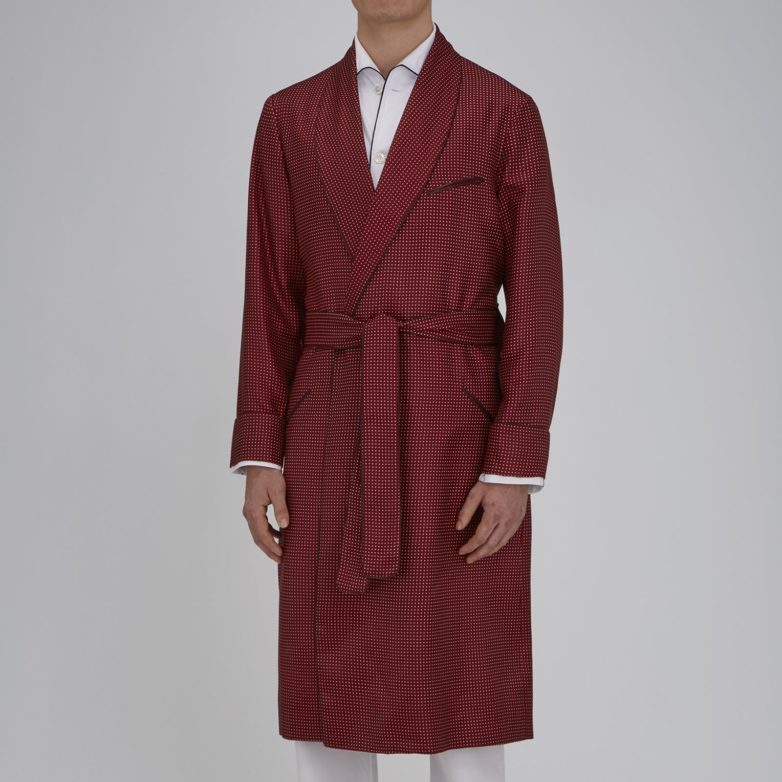 View 2 of product The Turnbull & Asser Burgundy Piped Silk Spot Gown features small white polka dots, a shawl collar, fabric belt, and chest pocket—luxurious nightwear and a stylish men’s statement piece—shown on a white background.