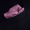 View 4 of product The Lilac and White Piped Silk Pocket Square by Turnbull & Asser features a smooth lilac silk fabric with a refined white piped edge and the brand's signature printed in white on the lower right corner.