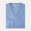 View 1 of product A Sky Blue Fine Cashmere V-Neck Jumper by Turnbull & Asser, neatly folded with visible ribbed collar and cuff, is displayed on a white background. The label appears inside the collar.