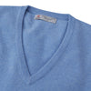 View 3 of product The Sky Blue Fine Cashmere Slipover by Turnbull & Asser is laid flat on a white background, showcasing its lightweight design and ribbed neckline, armholes, and hem for a refined finish.