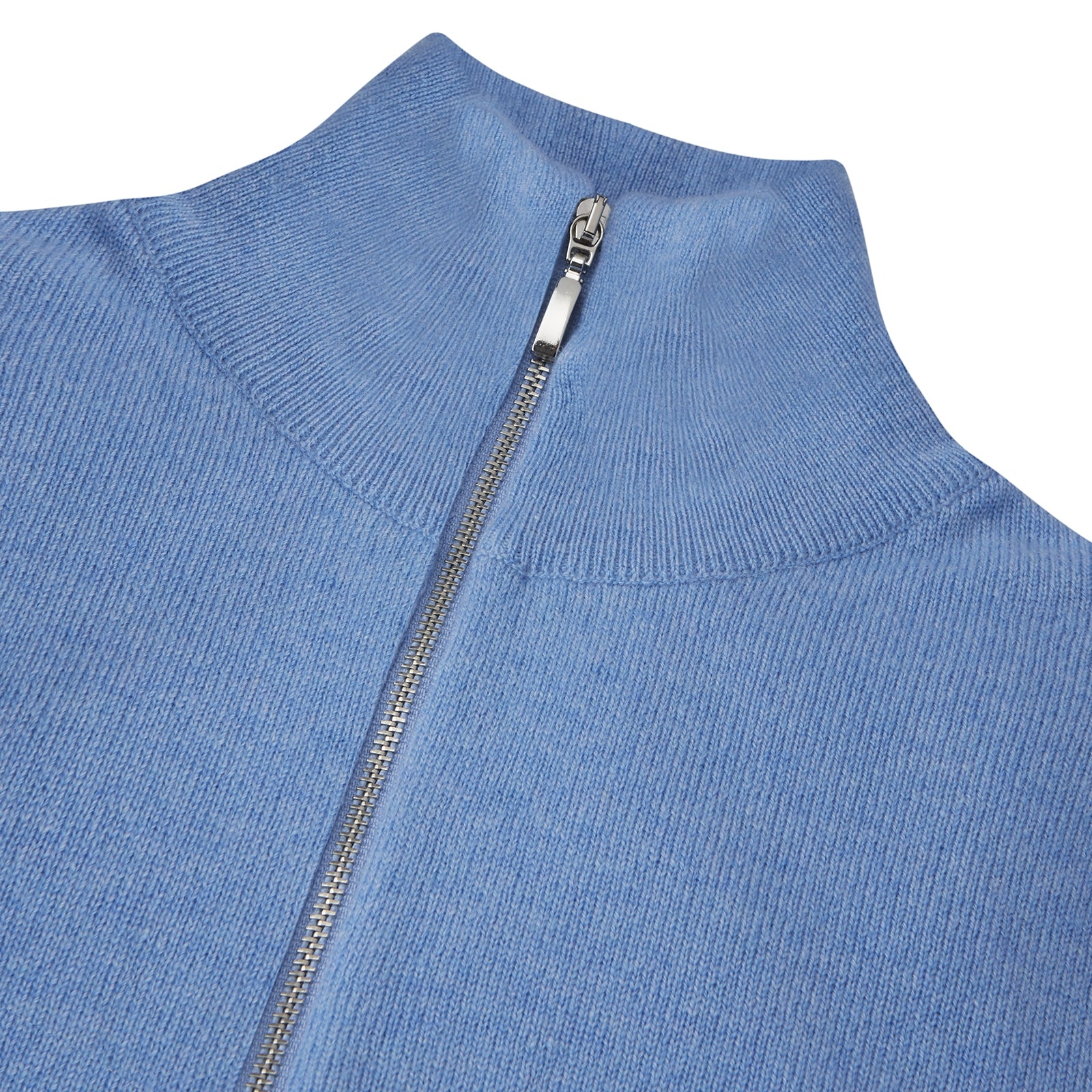 View 2 of product The Turnbull & Asser Sky Blue Half-Zip Cashmere Jumper is neatly folded with the zipper partially closed and one sleeve tucked underneath, displayed on a white background.