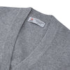 View 3 of product The Grey Fine Cashmere Cardigan by Turnbull & Asser is a long-sleeve, button-up sweater with two front pockets, shown on a white background.