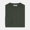 View 1 of product The Turnbull & Asser Green Crew Neck Cashmere Jumper, crafted from luxurious Scottish cashmere with ribbed cuffs, is neatly folded and displayed on a plain white background with the brand label visible inside the neckline.