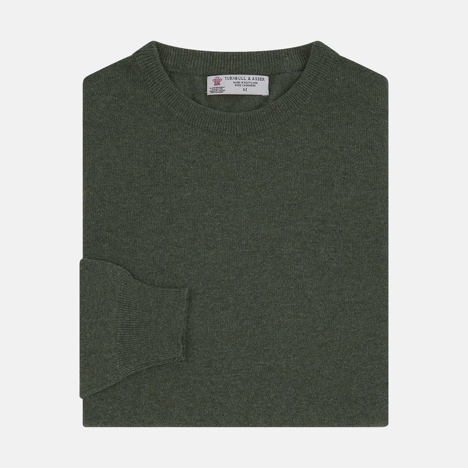 View 1 of product The Turnbull & Asser Green Crew Neck Cashmere Jumper, crafted from luxurious Scottish cashmere with ribbed cuffs, is neatly folded and displayed on a plain white background with the brand label visible inside the neckline.