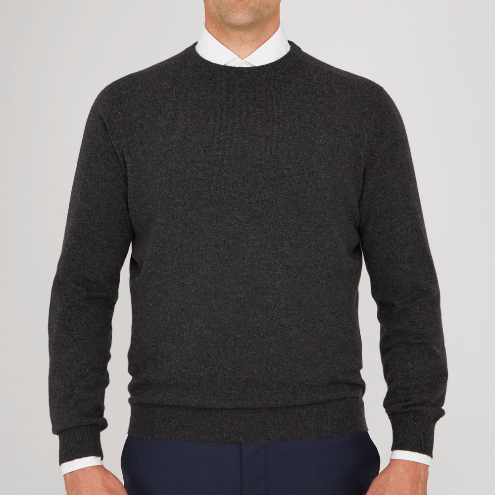 The Charcoal Crew Neck Cashmere Jumper by Turnbull & Asser is a luxury, long-sleeved sweater crafted from Scottish cashmere and shown on a white background.