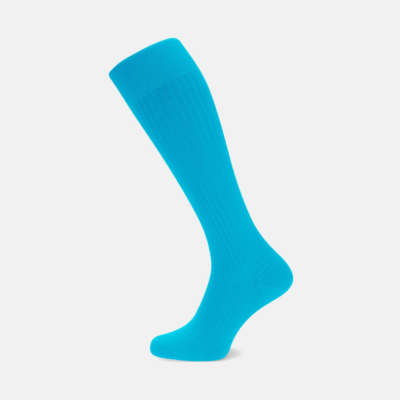 View 1 of product A single Turquoise Long Cotton Sock by Turnbull & Asser, crafted from soft Egyptian cotton, is shown knee-high against a plain light gray background, positioned as if worn.