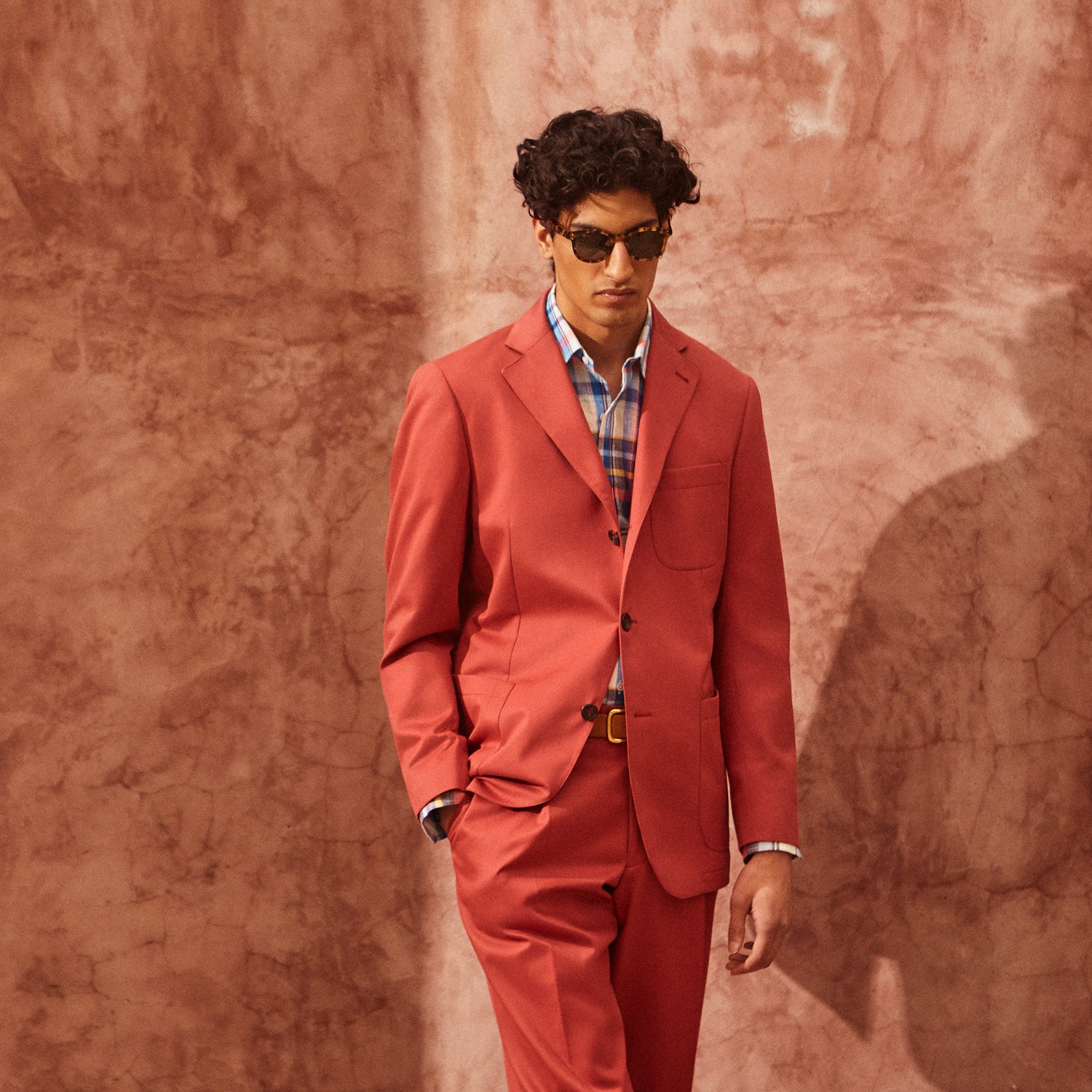 View 3 of product Turnbull & Asser Clay Red Cotton Twill Pleated Trousers feature a tailored fit, side pockets, and front button closure. Made in Italy, they're ideal for smart casual looks and are showcased against a plain white background.
