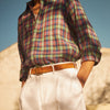 View 2 of product Turnbull & Asser’s White Cotton Pleated Trousers, a summer classic, are elegantly displayed against a crisp white backdrop.
