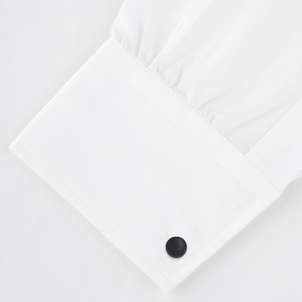 Turnbull & Asser's Reversible Onyx and Mother-of-Pearl Bulb Sterling Silver Cufflinks have curved bars with black onyx on one end and white mother-of-pearl on the other, perfect for elevating a black tie look. Shown on a plain white background.