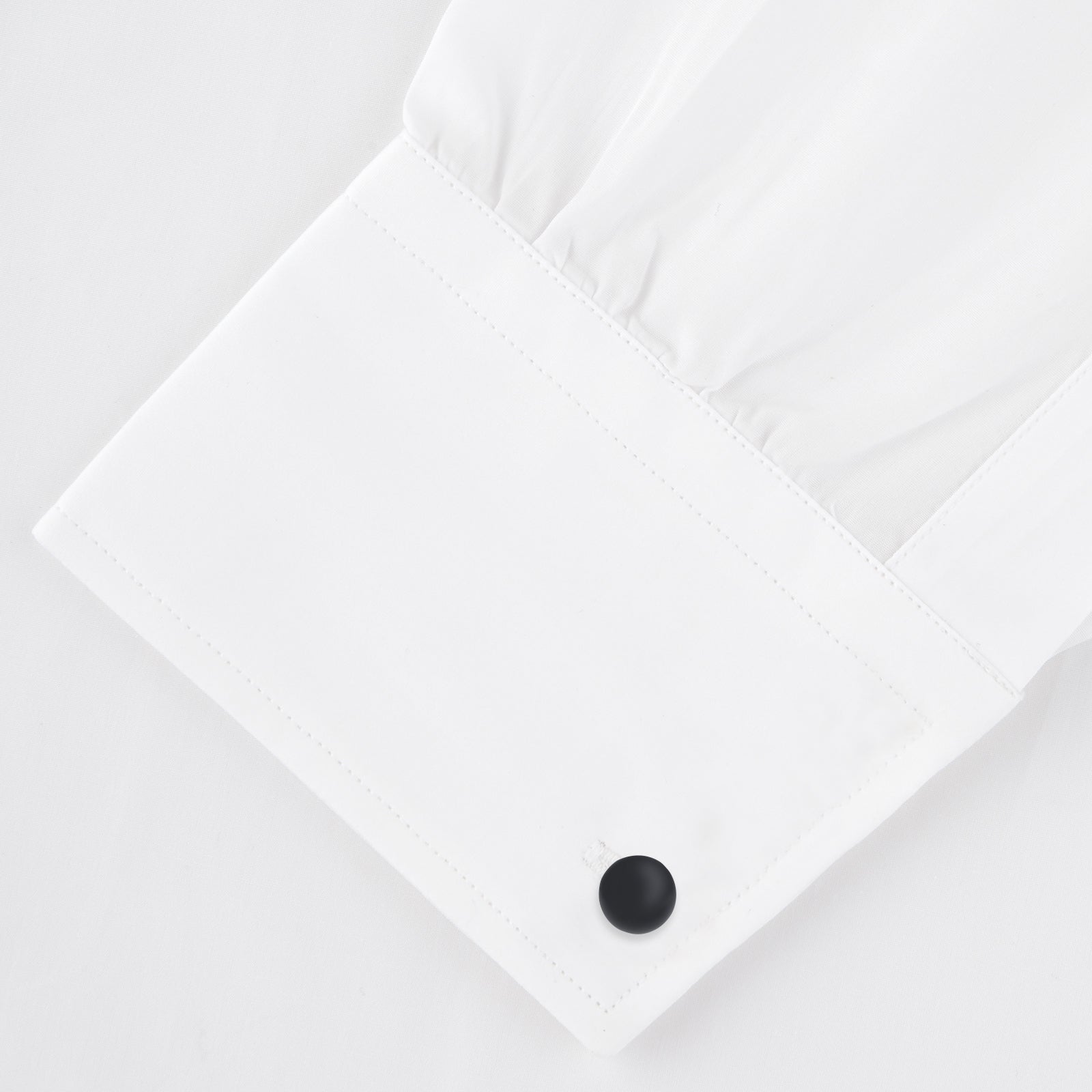 View 4 of product Turnbull & Asser's Reversible Onyx and Mother-of-Pearl Bulb Sterling Silver Cufflinks have curved bars with black onyx on one end and white mother-of-pearl on the other, perfect for elevating a black tie look. Shown on a plain white background.