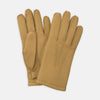 View 1 of product Turnbull & Asser Camel Deerskin Leather Gloves feature visible stitching and decorative lines on the back, shown against a white background to highlight their timeless casual style.