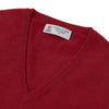 View 2 of product The Deep Red V-Neck Cashmere Jumper by Turnbull & Asser features long sleeves, ribbed cuffs and collar, and an inner collar label. Displayed on a white background, it's ideal for smart casual looks.